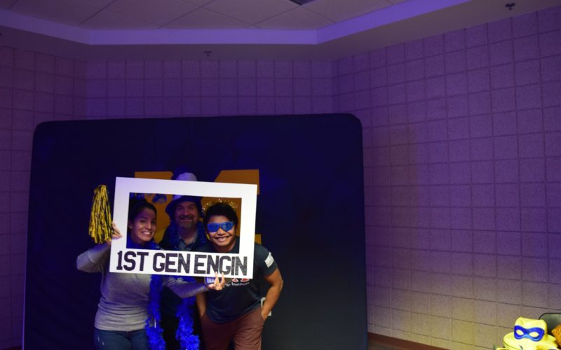 3 people at 1st gen engin photo zone