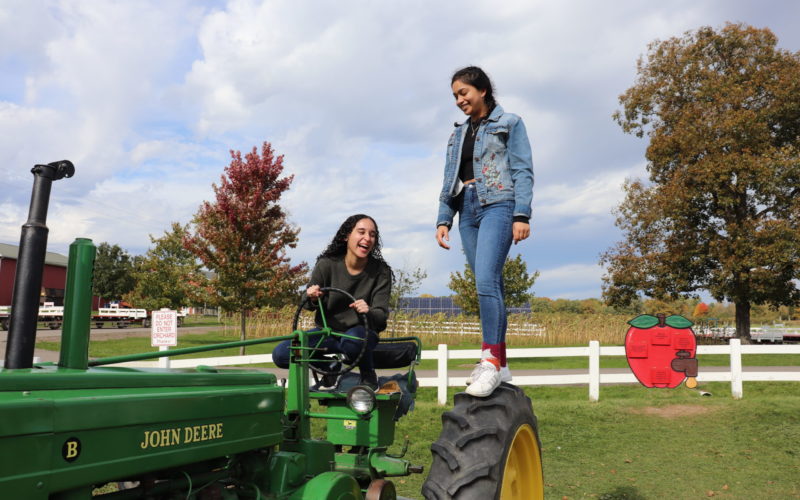 3 people on a tractor